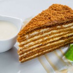 Piece of honey cake with smetana cream