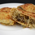 Pancakes stuffed with stewed cabbage 